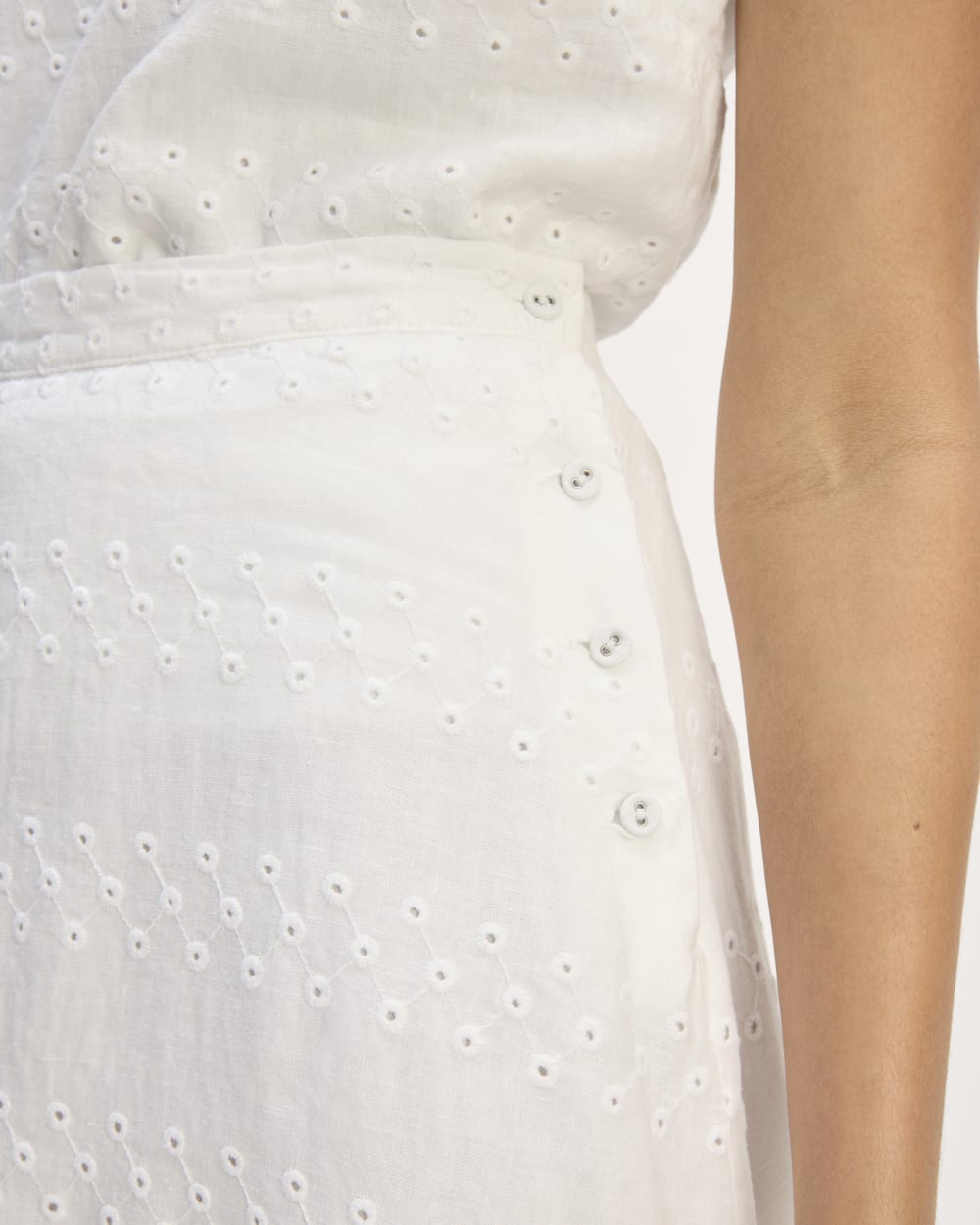 The Linen Eyelet Midi Skirt in White Eyelet — detail view