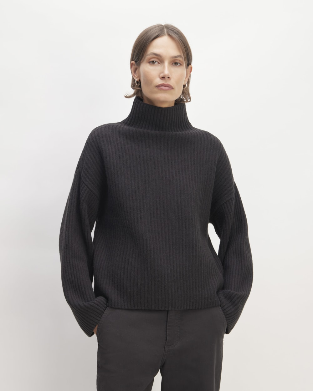 The Felted Merino Funnel-Neck Pullover in Black — front view