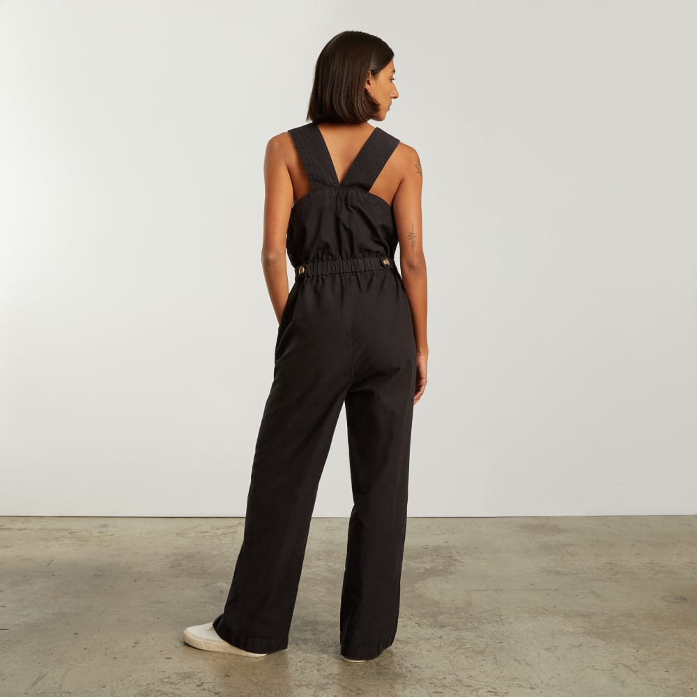 The Fatigue Apron Jumpsuit in Black — detail view
