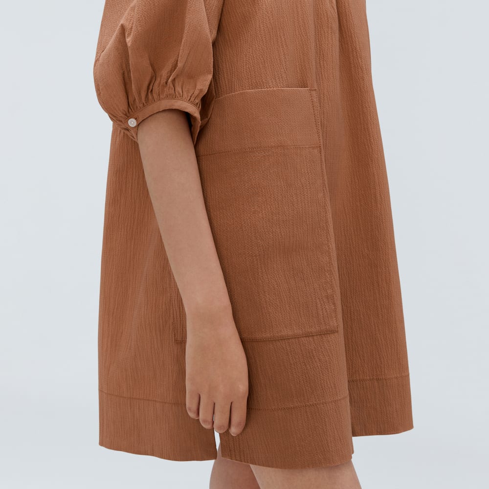 The Seersucker Puff Sleeve Dress in Tawny Brown — detail view