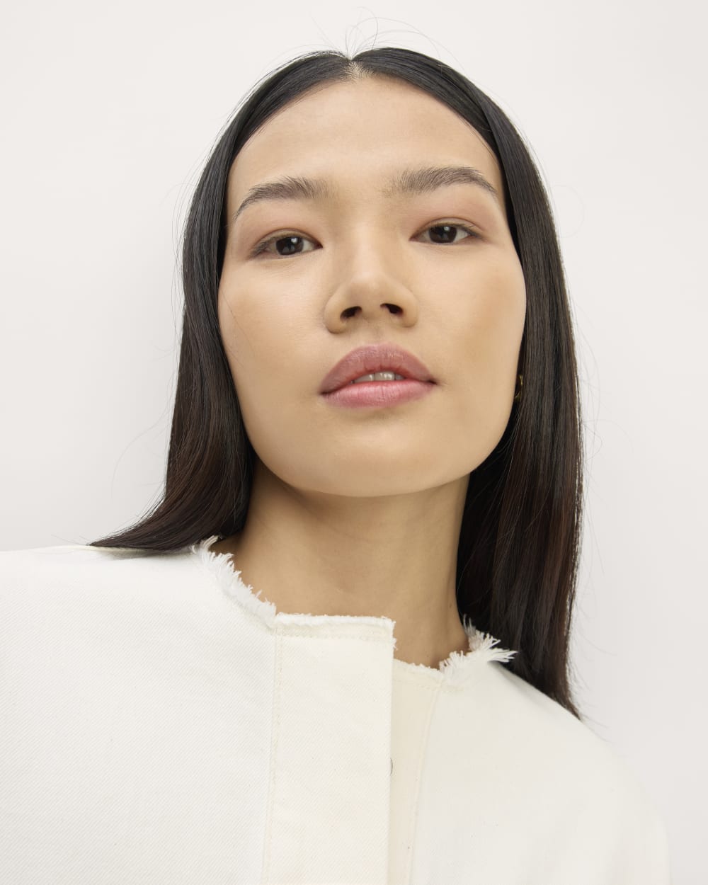 The Denim Workwear Shirtdress in Frayed Hem Bone — detail view