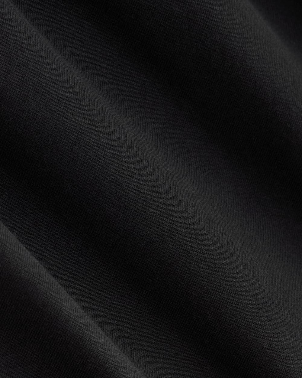 The Slim V-Neck Tee in Essential Cotton in Black — detail view