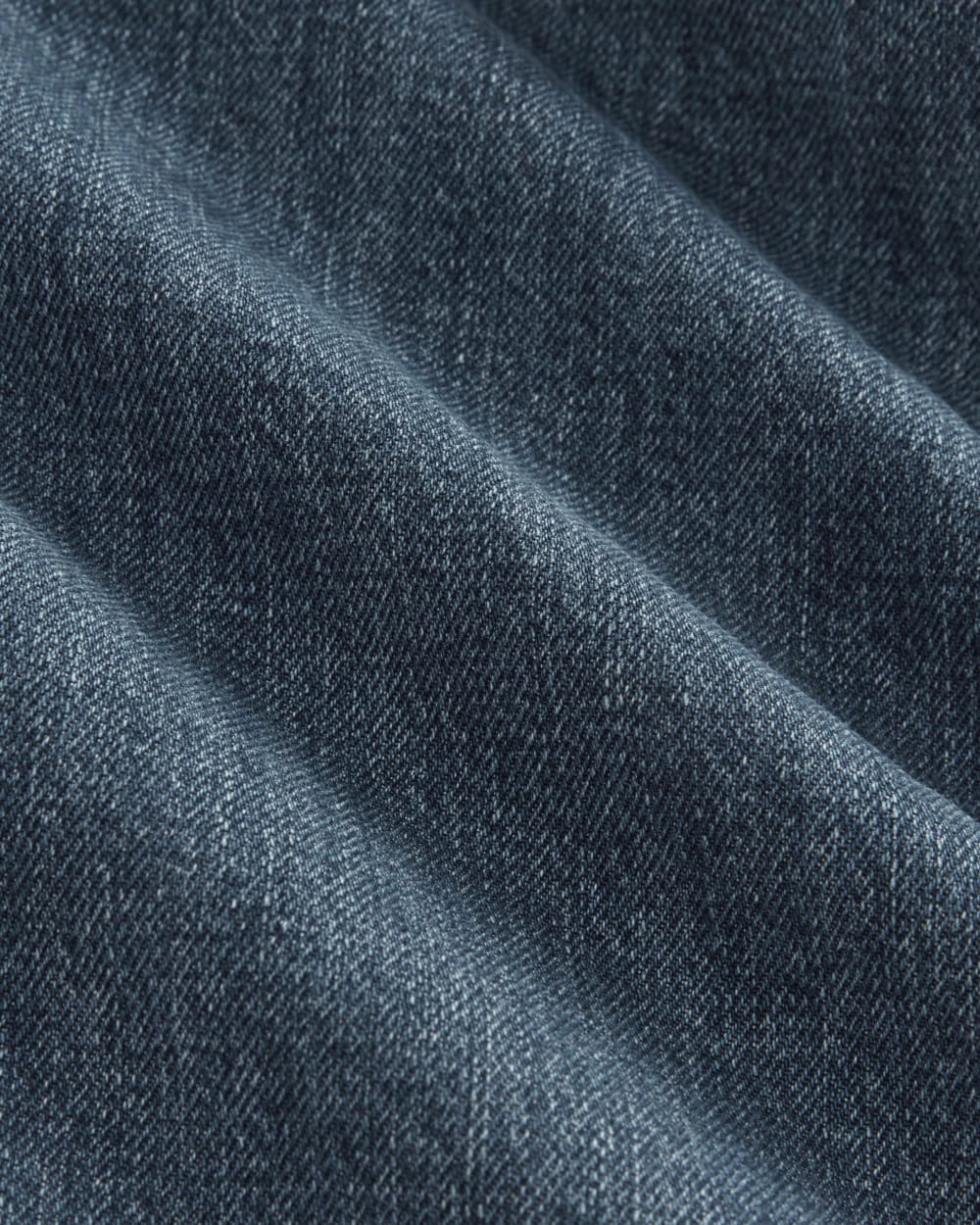 The High Rise Pleated Jean in Mid Indigo — detail view