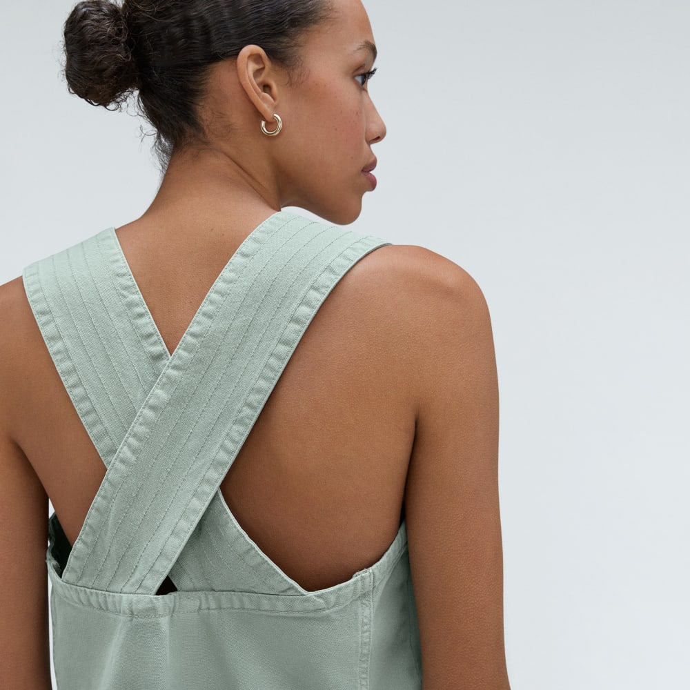 The Cross-Back Apron Mini Dress in Sea Glass — detail view