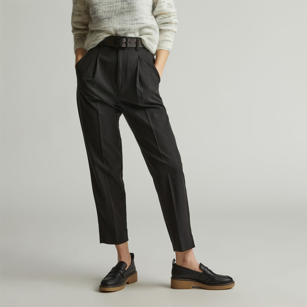 The Draper Tapered Pant in Buttersmooth in Black — detail view