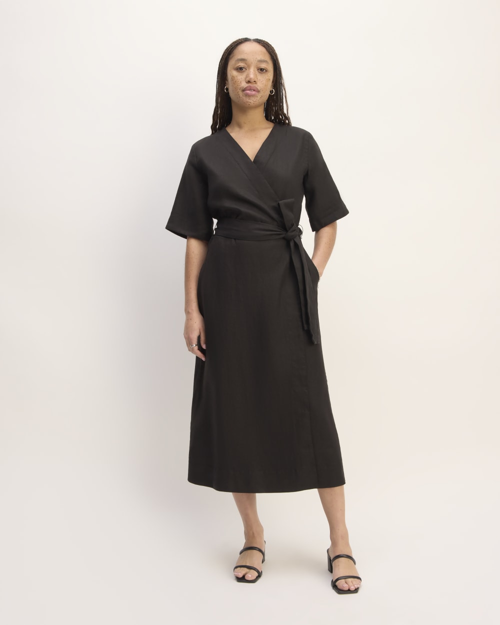 The Wrap Dress in Linen in Black — front view