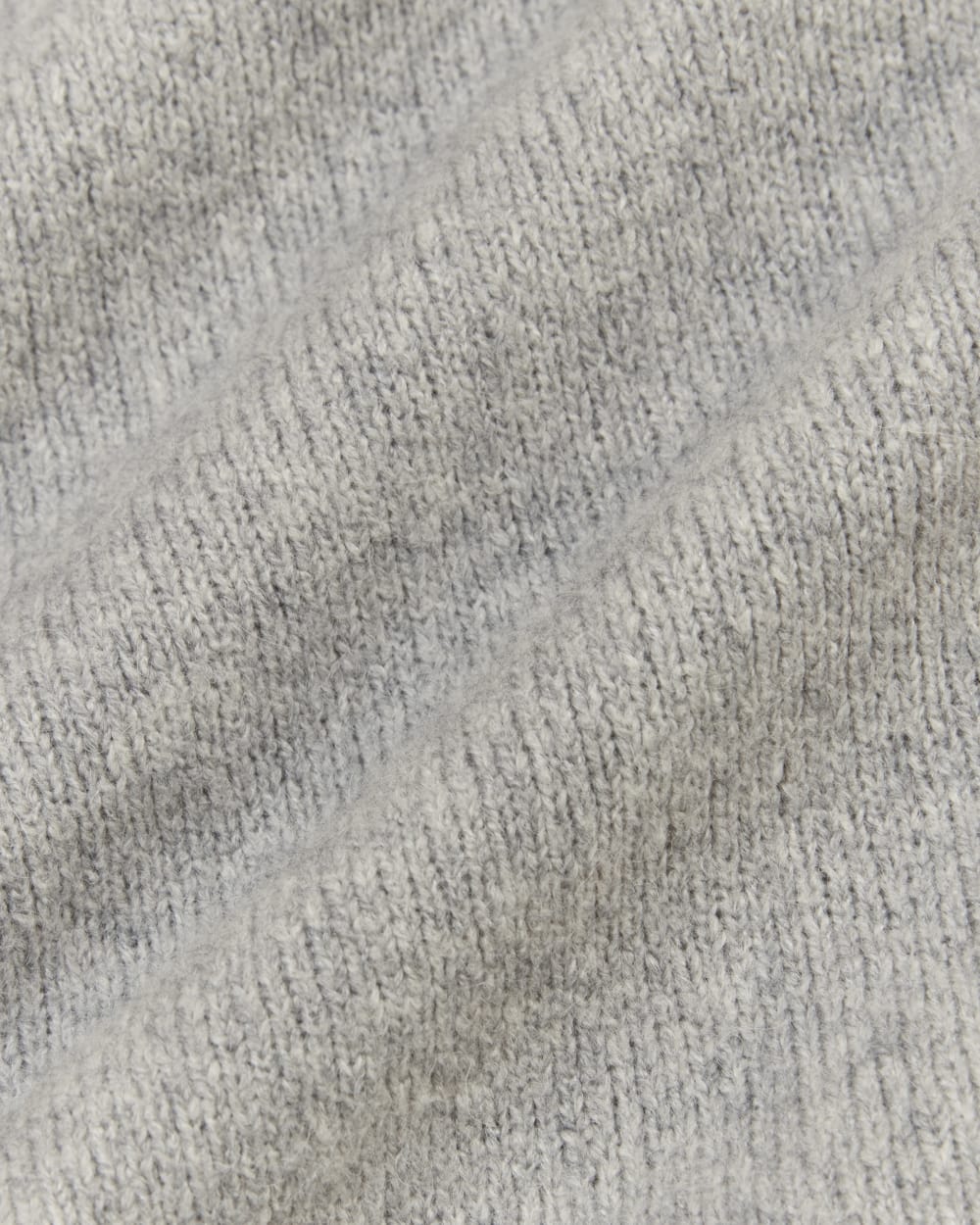 The V-Neck Sweater in Plush Cotton in Heathered Grey — detail view