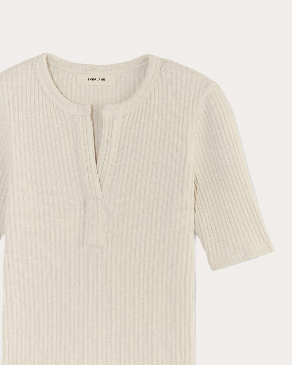 The Rib-Knit Short-Sleeve Henley in Bone — detail view