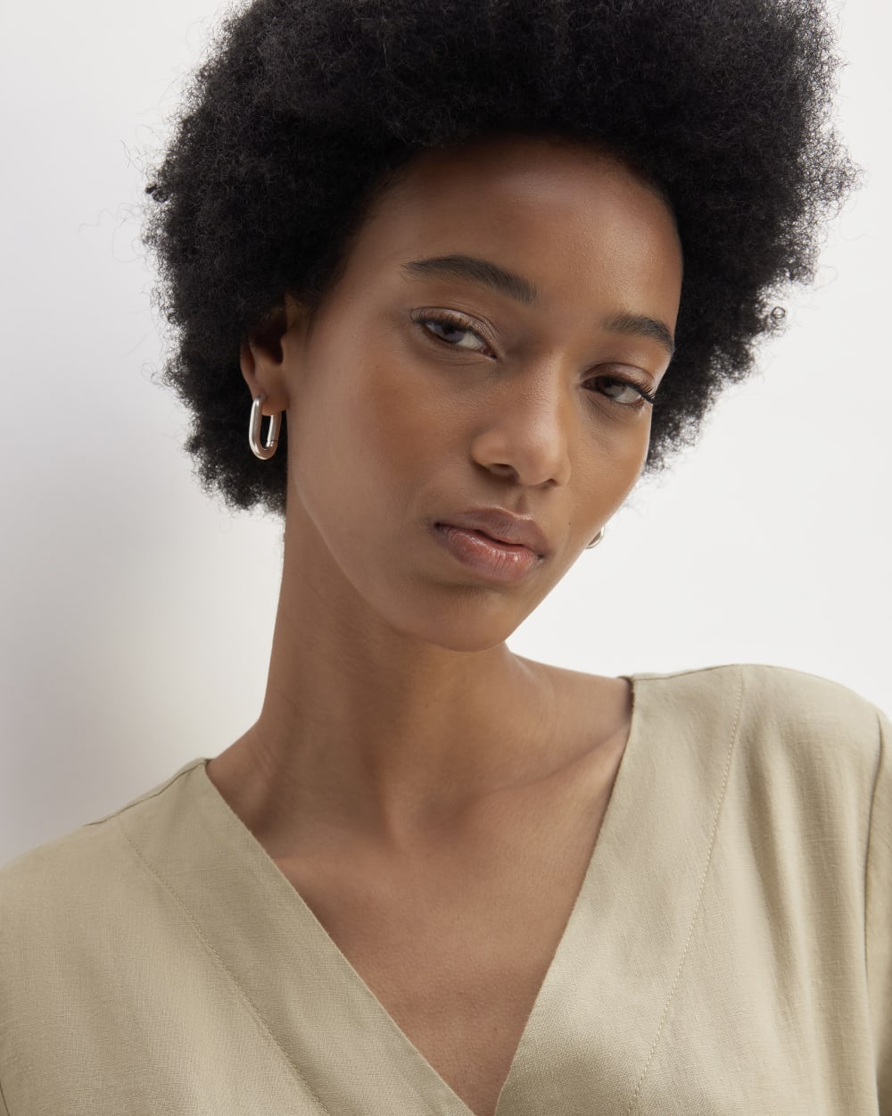 The Wrap Jumpsuit in Linen in Trench Coat Khaki — detail view