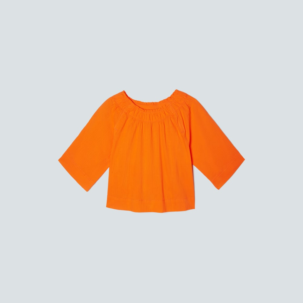 The Seersucker Gathered Tee in Bright Orange — front view