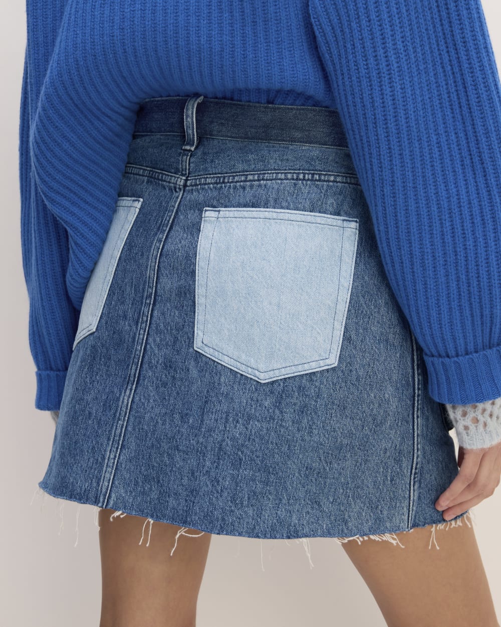 The Everlane x Marques' Almeida Denim Patchwork Mini Skirt in Diamond Blue — detail view