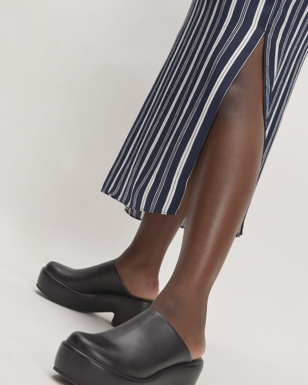 The Hammered Satin Slip Dress in Navy / Bone — detail view