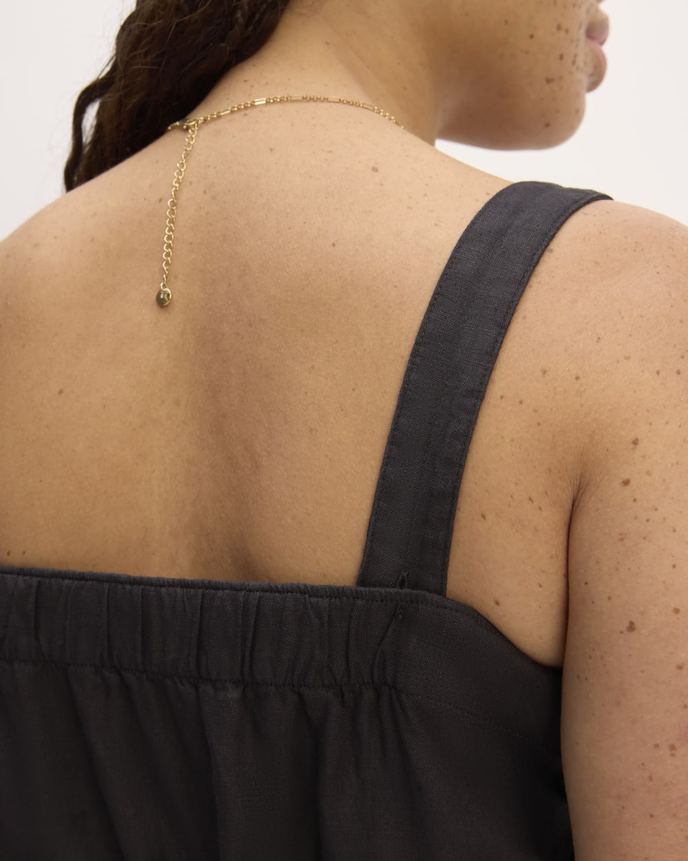 The Linen Side-Button Jumpsuit in Black — detail view