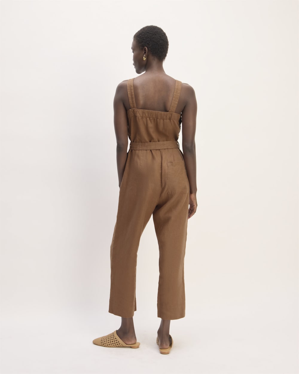 The Linen Side-Button Jumpsuit in Carob Brown — detail view