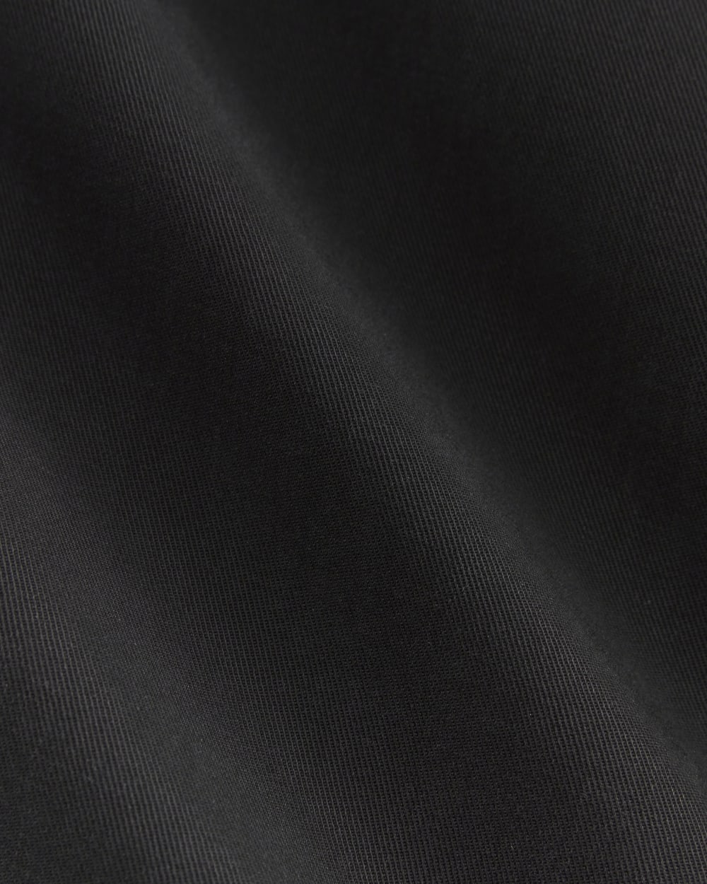 The Draper Pleated Pant in Buttersmooth in Black — detail view