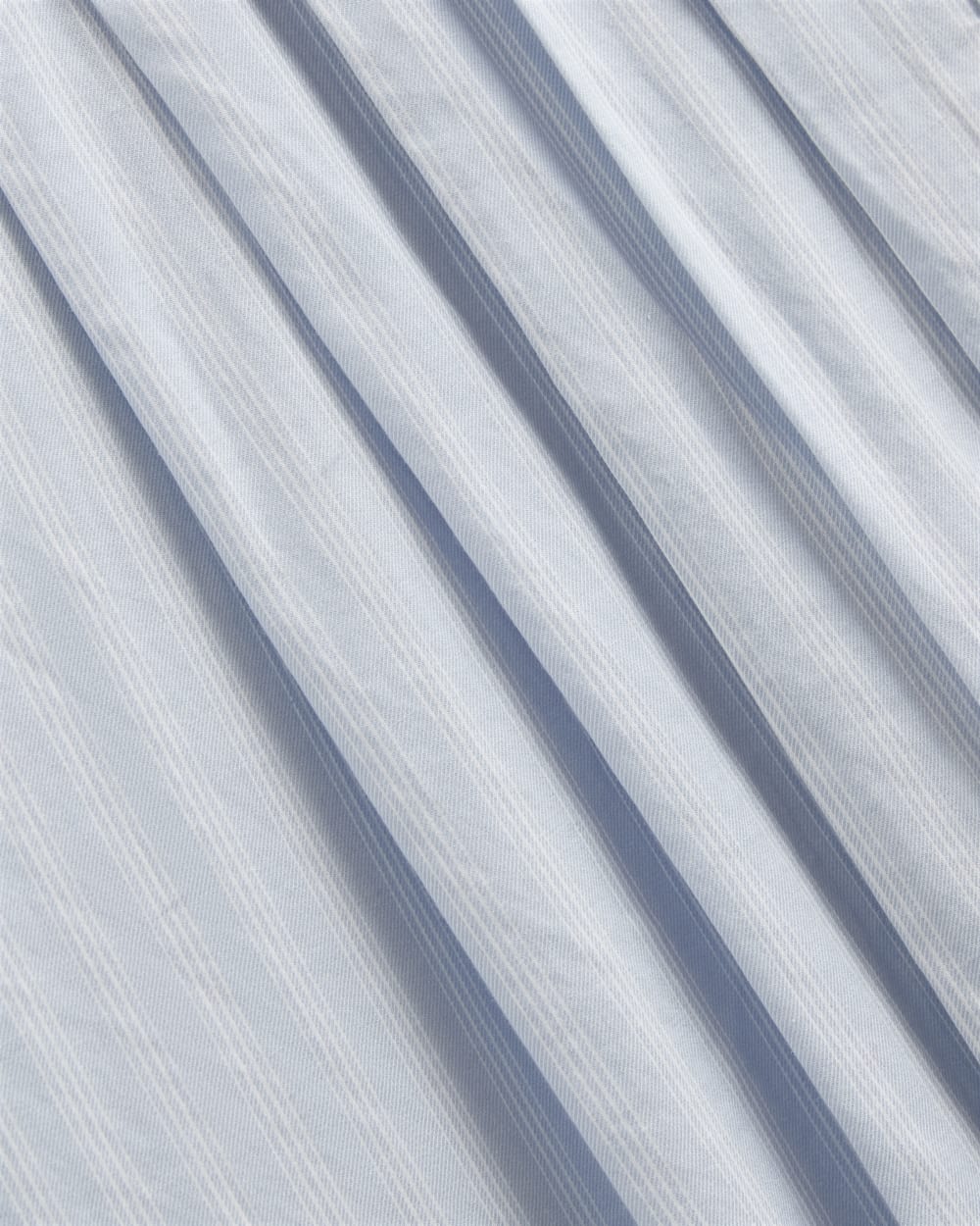 The Pleated Shirt in Silky Cotton in Forever Blue / Optic White — detail view