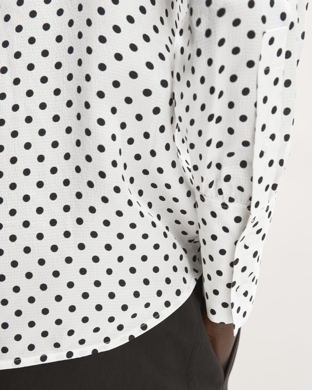 The Hammered Satin Popover Shirt in Bone / Black Polka Dot — detail view