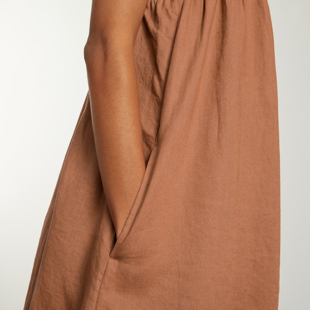 The Smocked Linen Dress in Tawny Brown — detail view