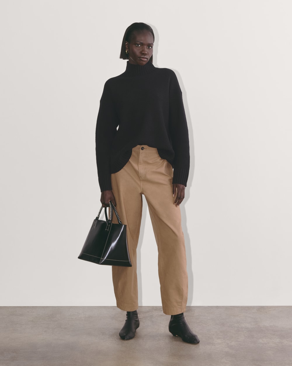 The Honeycomb Funnel Neck in Wool Cashmere in Black — detail view