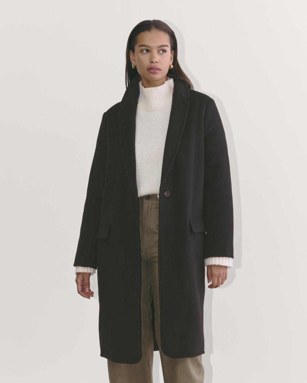 The Topcoat in Wool in Black — front view
