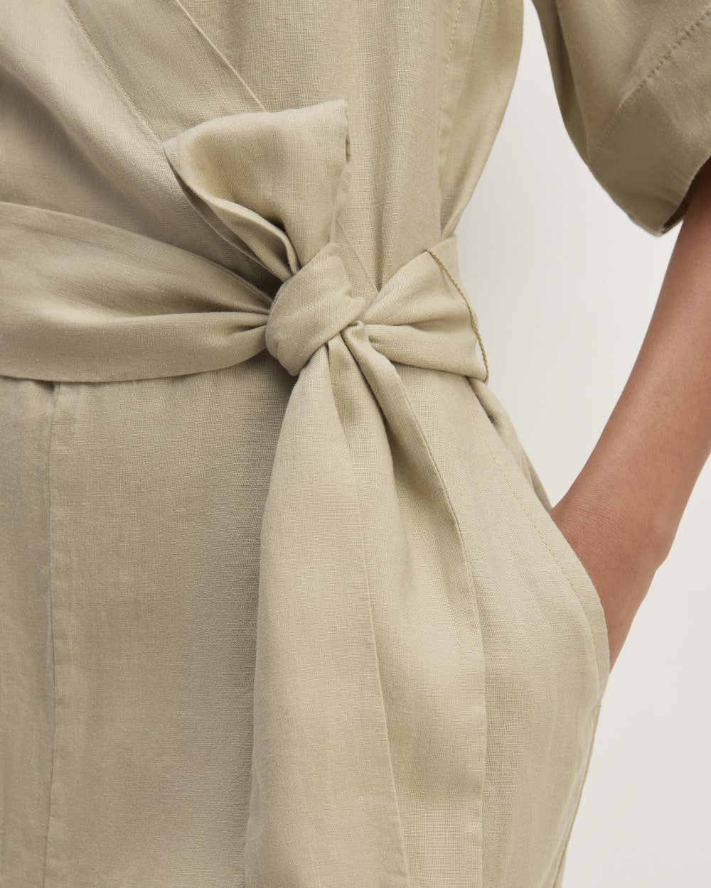 The Wrap Jumpsuit in Linen in Trench Coat Khaki — detail view