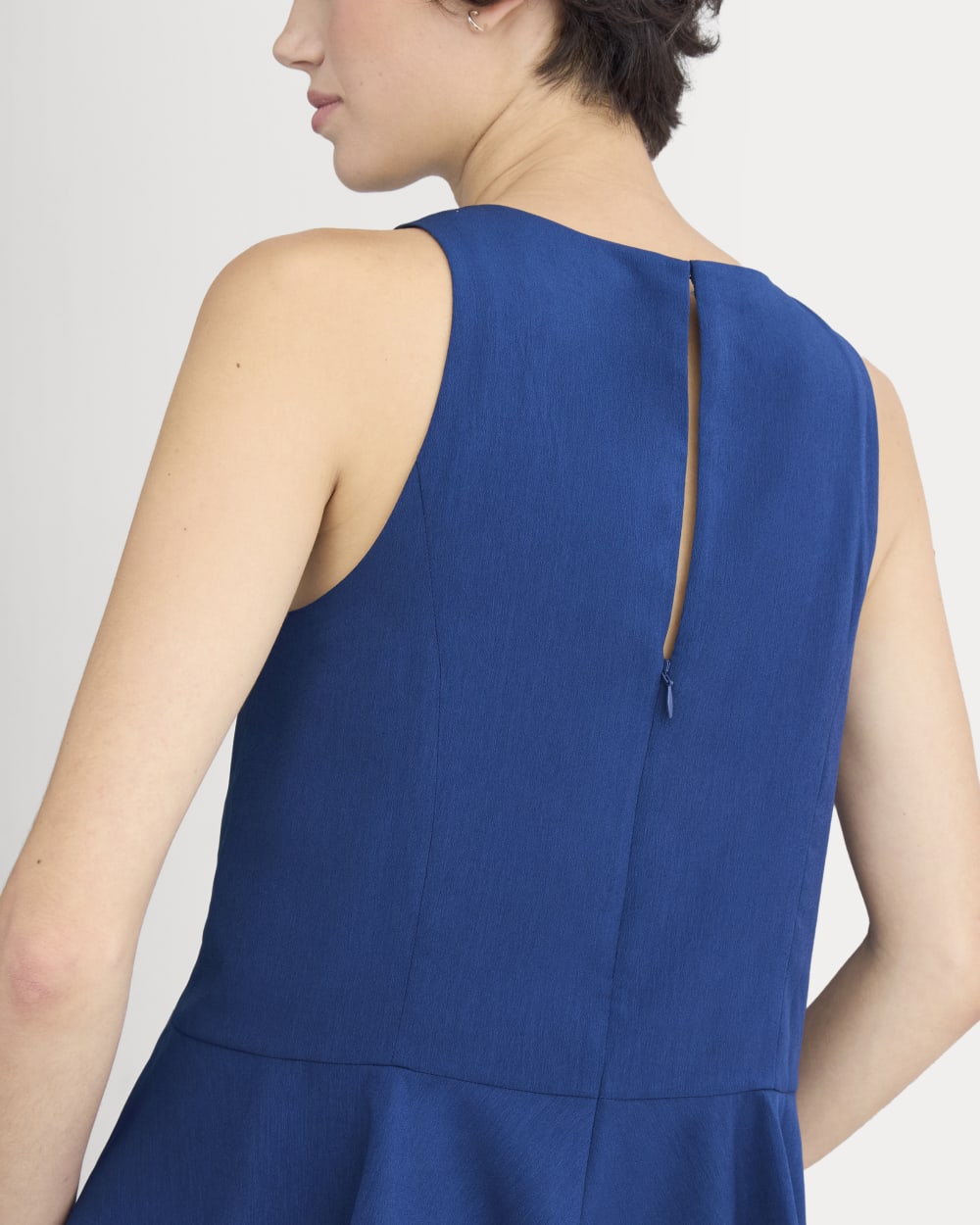 Sleeveless Peplum Top in Estate Blue — detail view