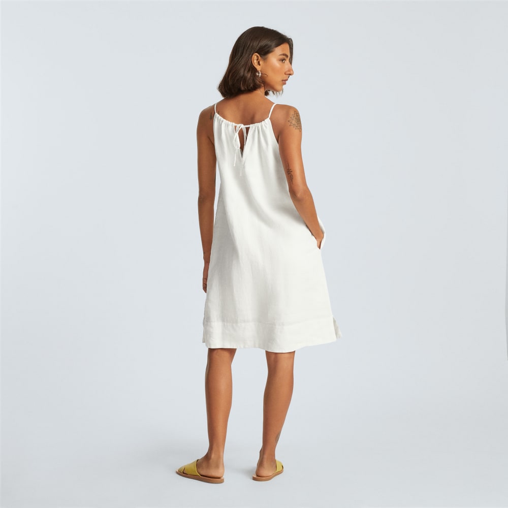 The Linen Apron Dress in White — detail view