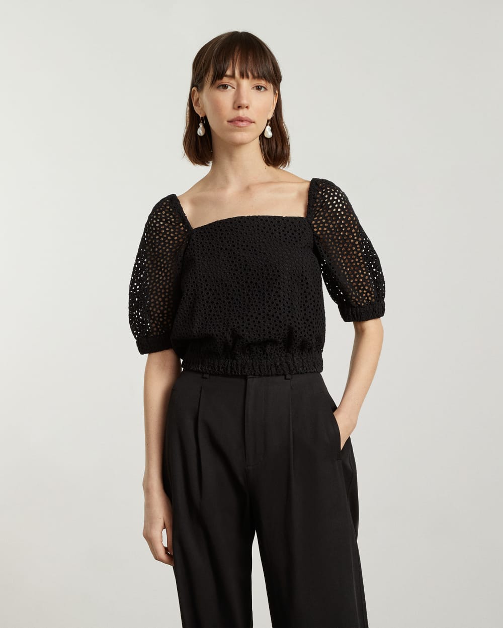 The Eyelet Puff Sleeve Top in Black — detail view