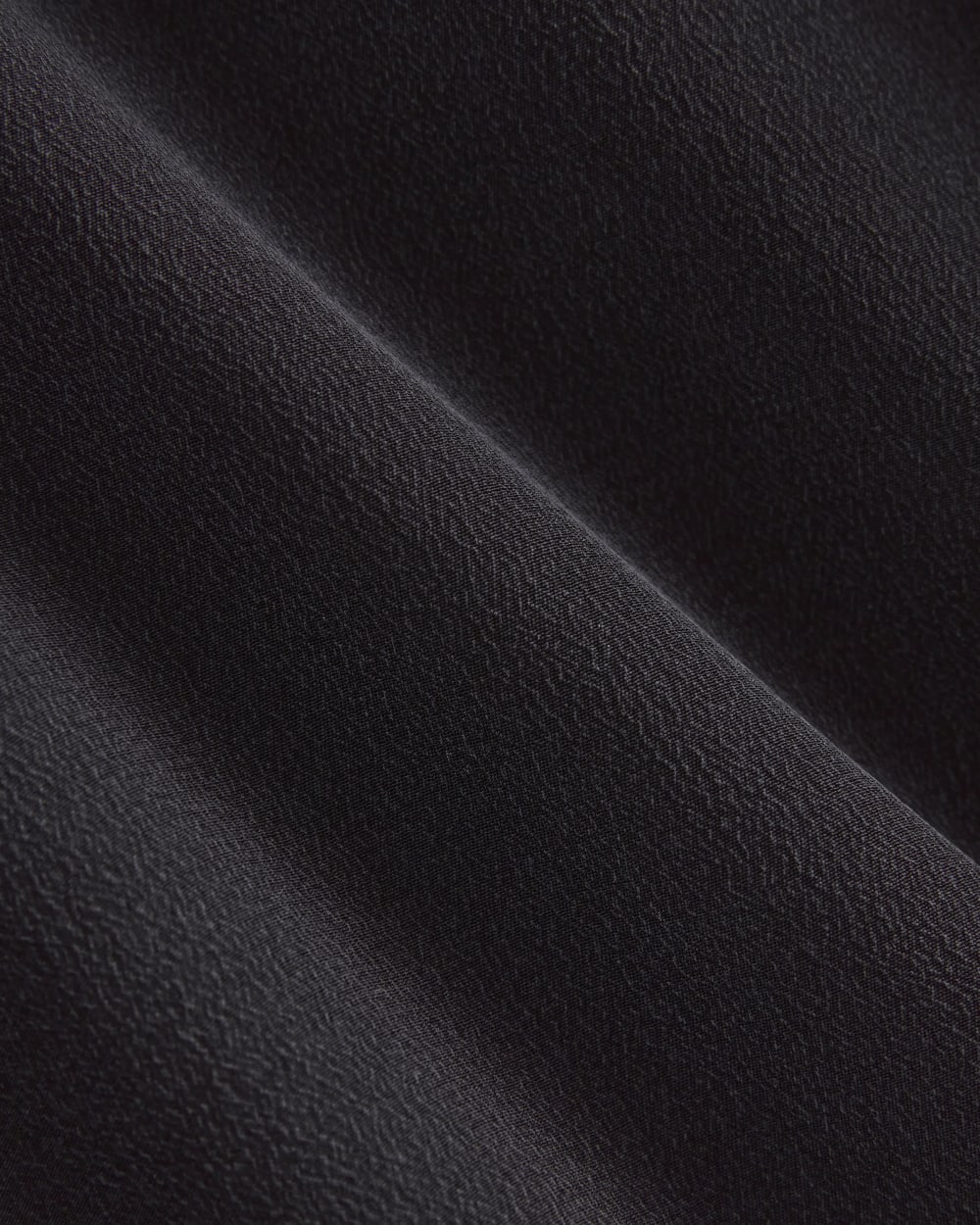 The Notch Shirt in Washable Silk in Black — detail view