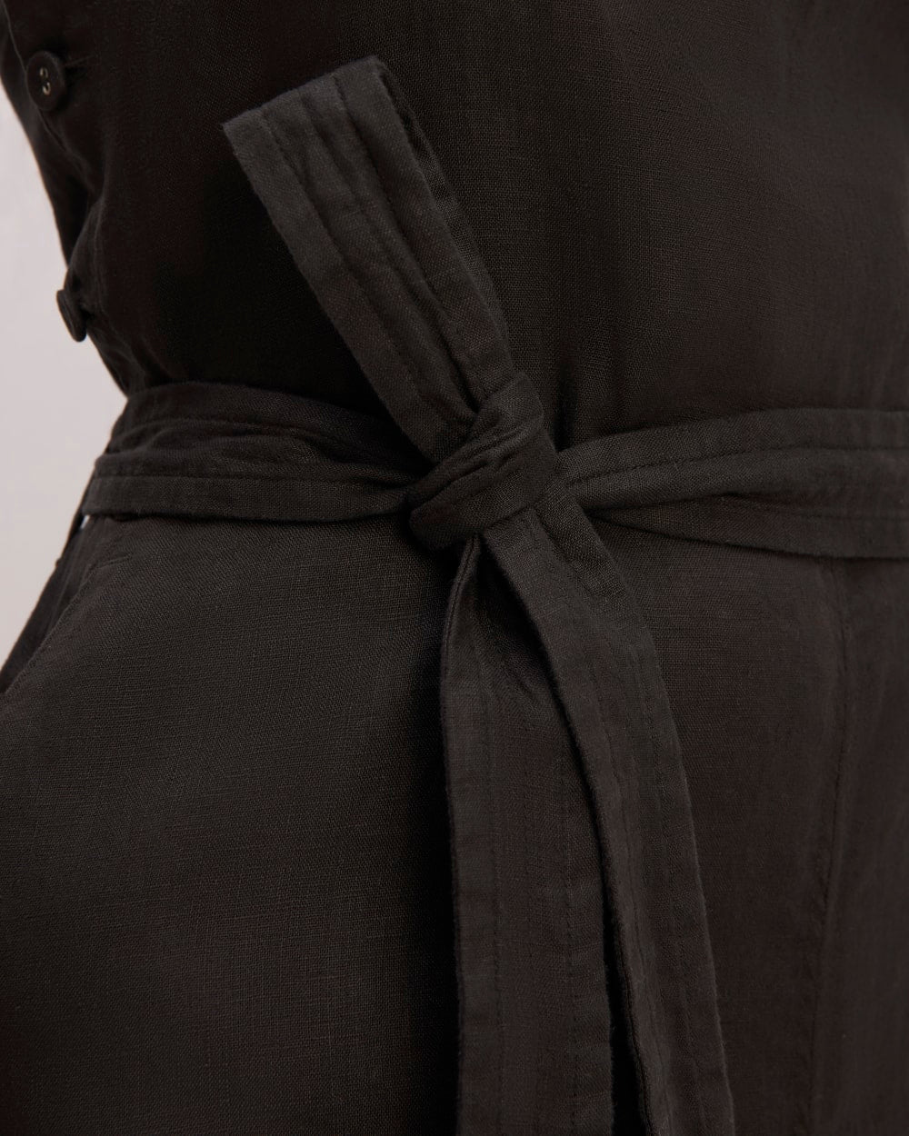 The Linen Side-Button Jumpsuit in Black — detail view