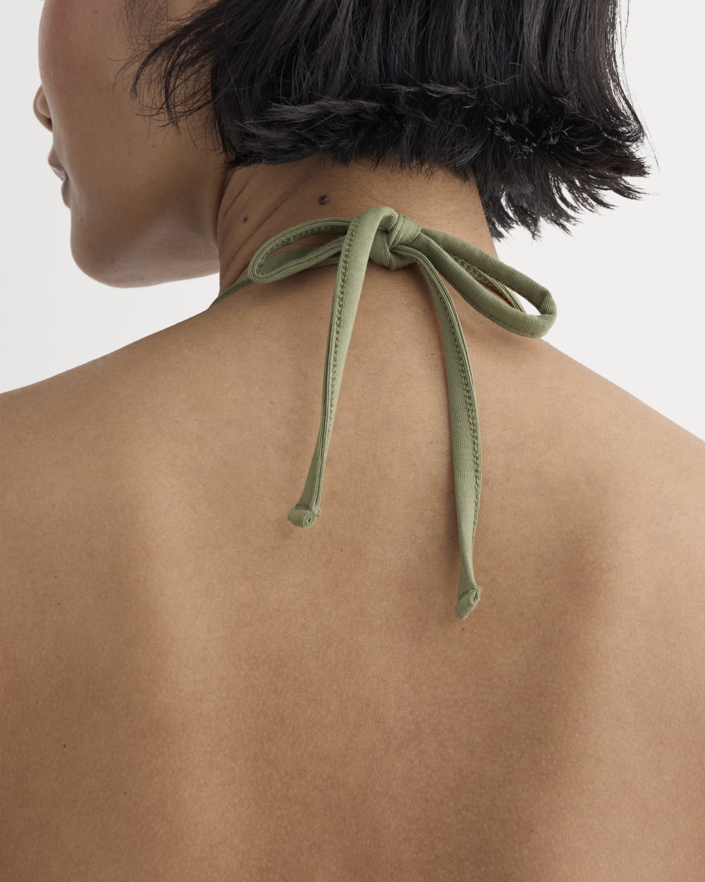 The Form Halter Top in Lichen Green — detail view