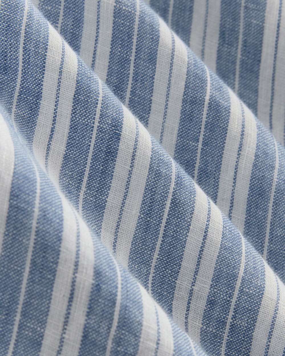 The Daytripper Dress in Linen in Soft Cobalt/Bone — detail view