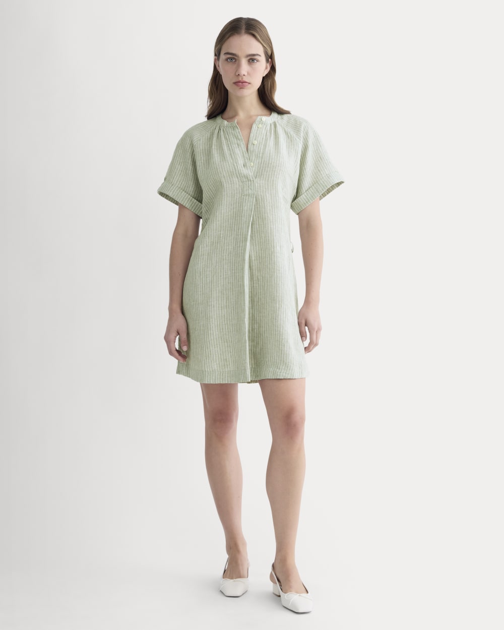 The Popover Dress in Linen in Oil Green / White — front view