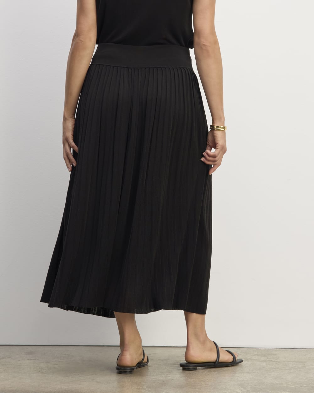 The Pleated Skirt in Black — detail view