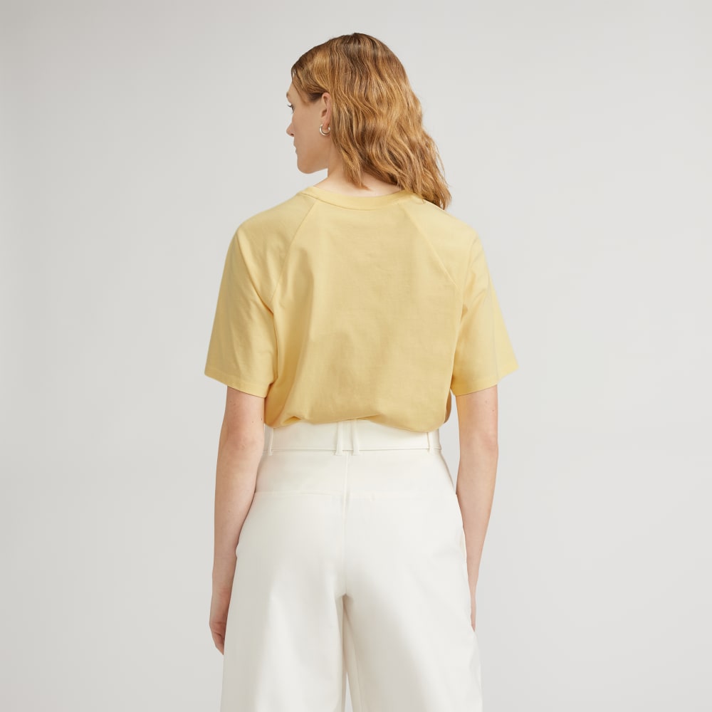The Organic Cotton Raglan Tee in Pale Yellow — detail view