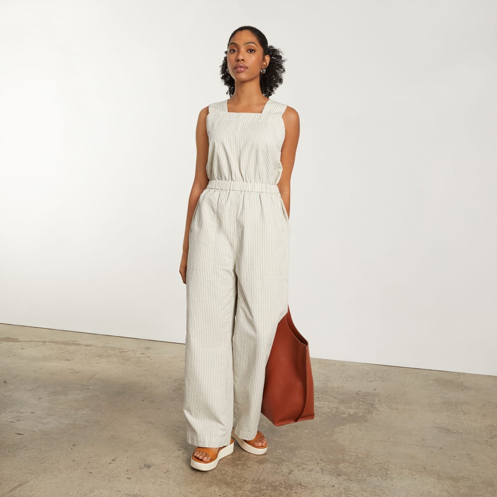The Fatigue Apron Jumpsuit in Navy Stripe — detail view
