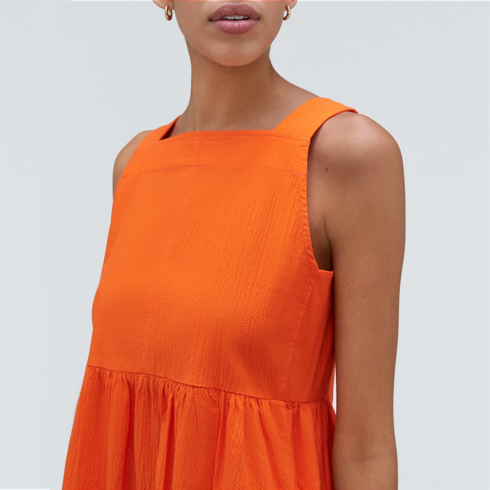 The Seersucker Midi Dress in Bright Orange — detail view