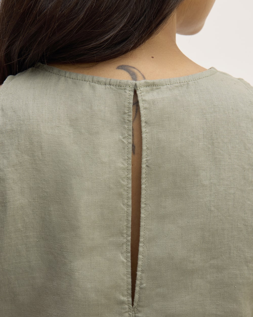 The Linen High-Neck Tank in Sage Green — detail view