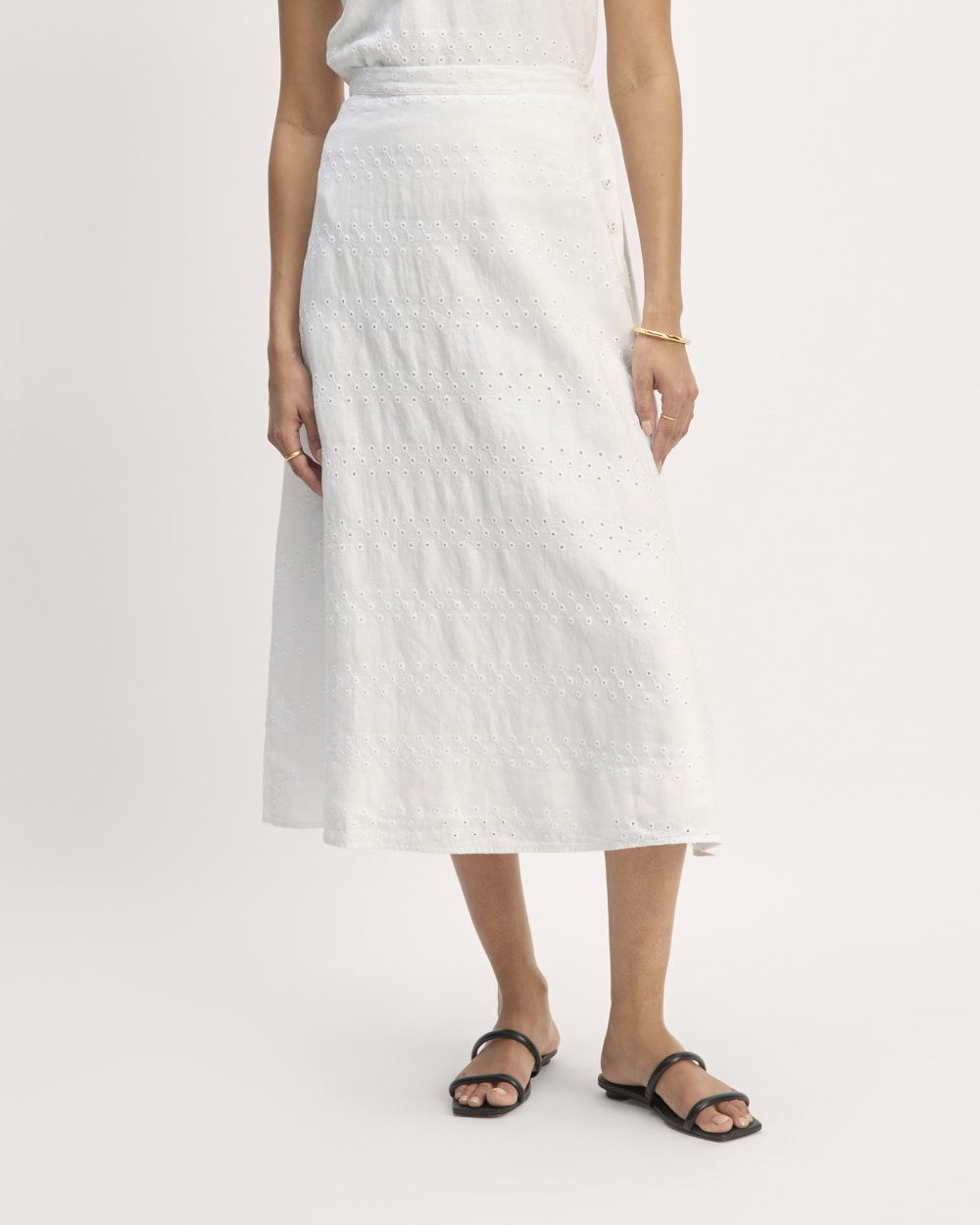 The Linen Eyelet Midi Skirt in White Eyelet — detail view