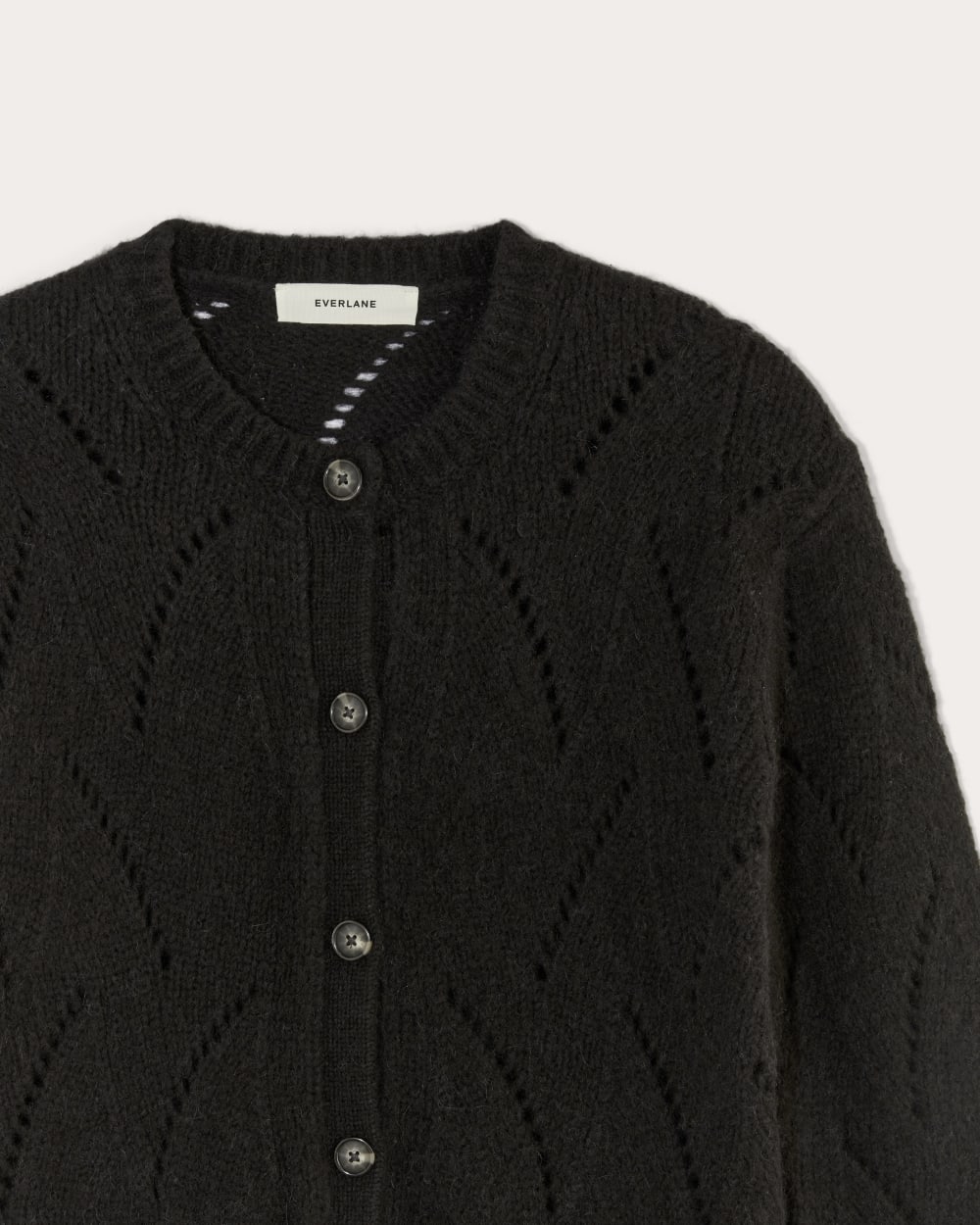 The Pointelle Cardigan in Cloud in Black — detail view