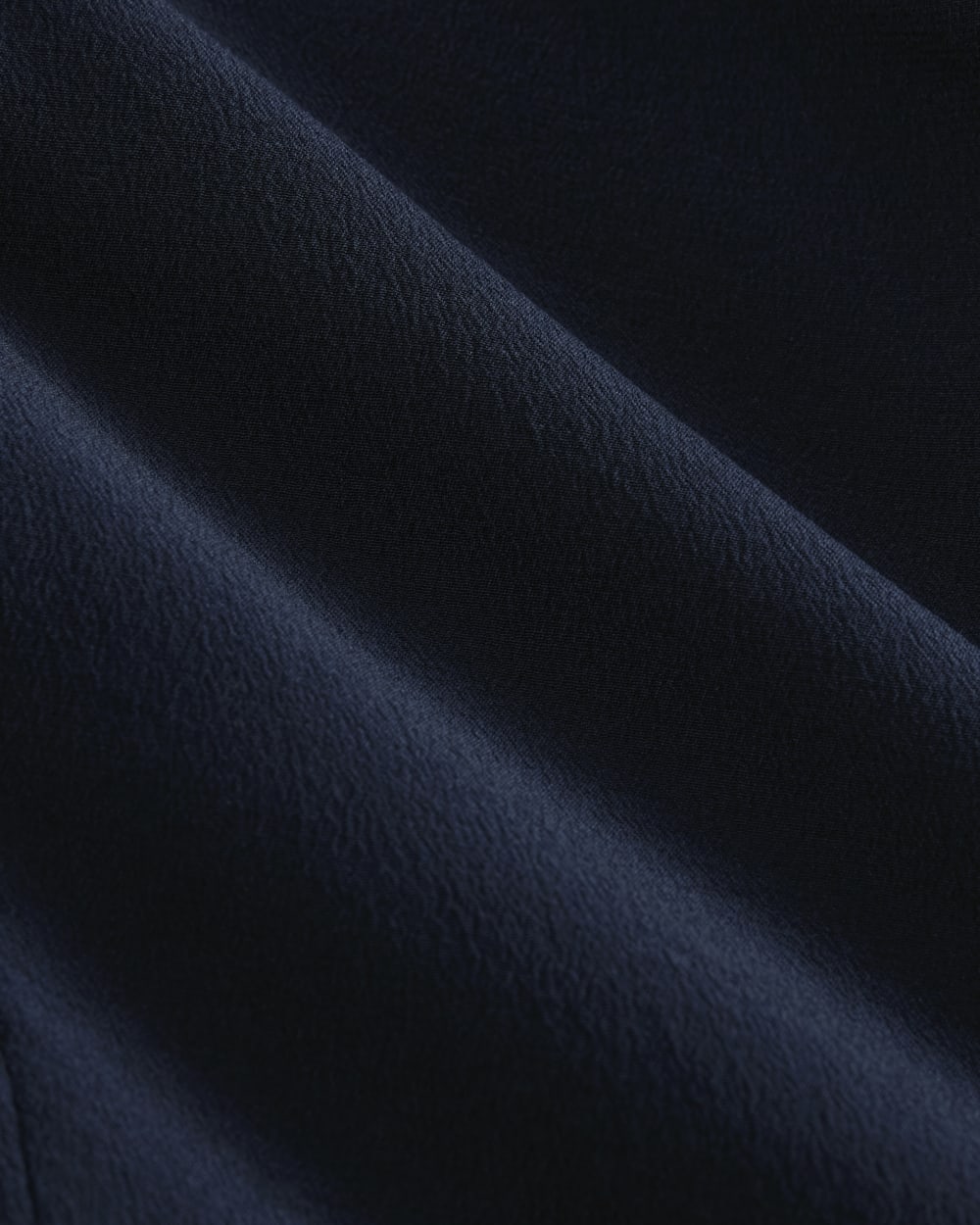 The V-Neck Blouse in Washable Silk in Navy — detail view