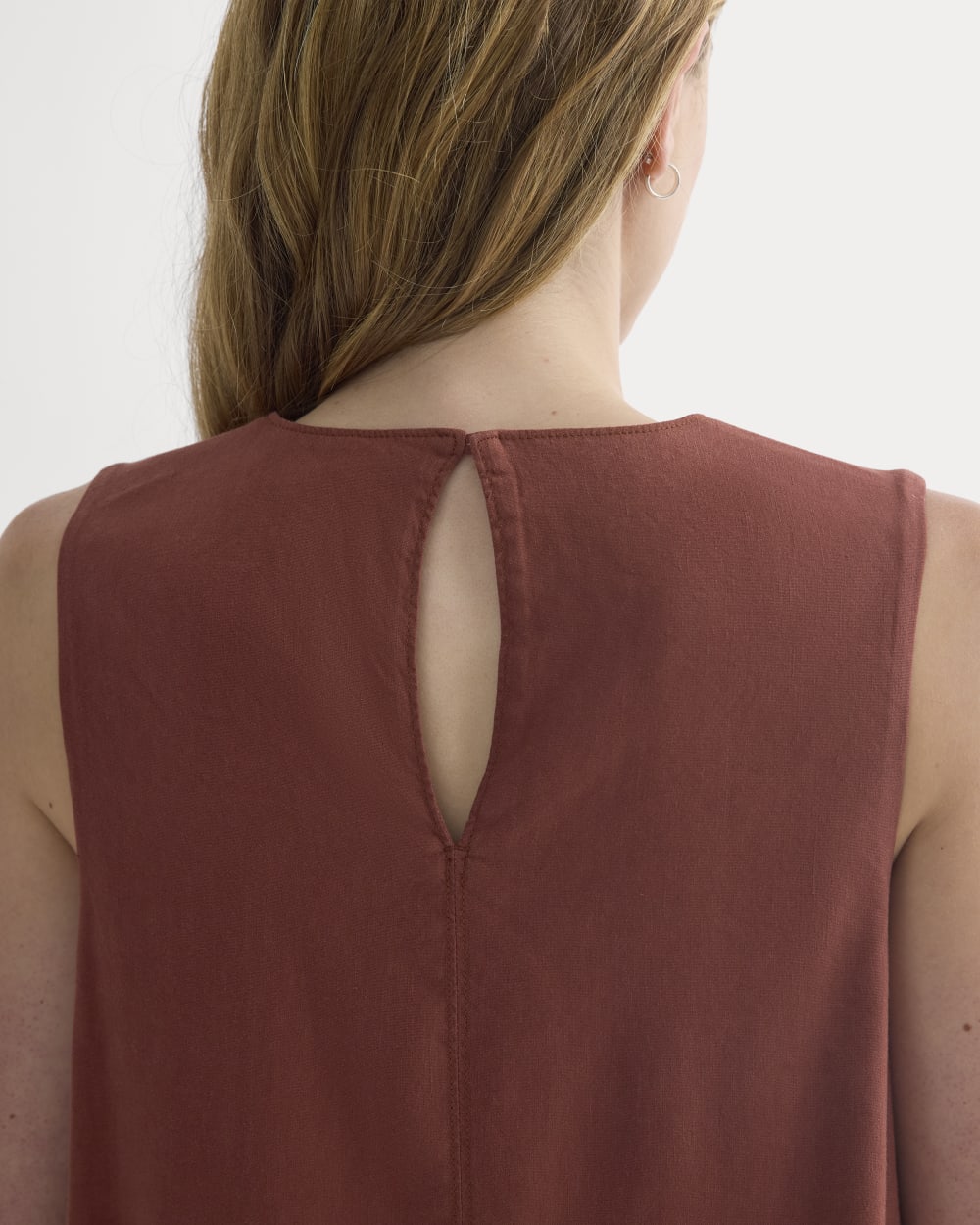The Shift Dress in Stretch Linen in Henna Red — detail view
