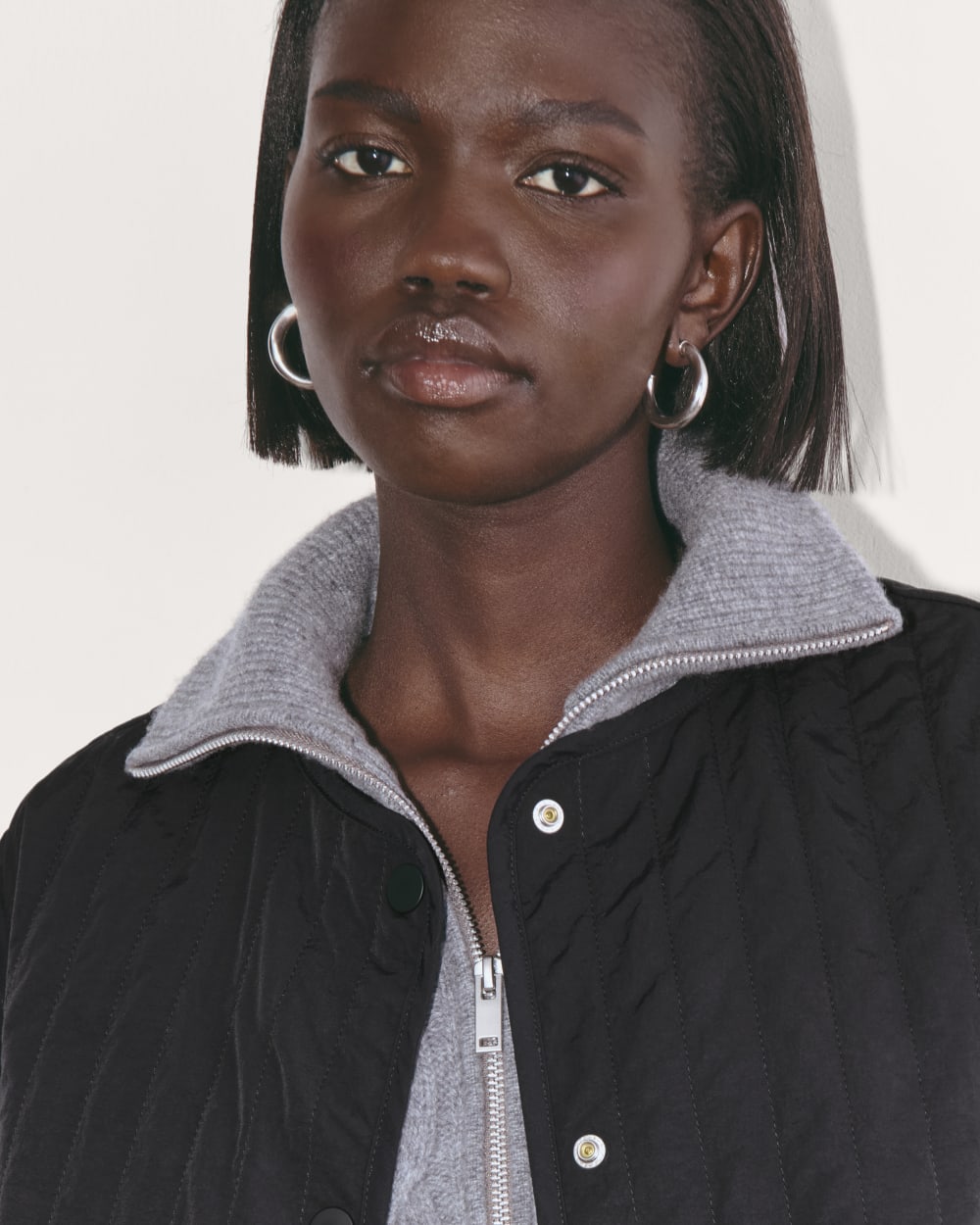 The Midi Quilted Liner in Black — detail view