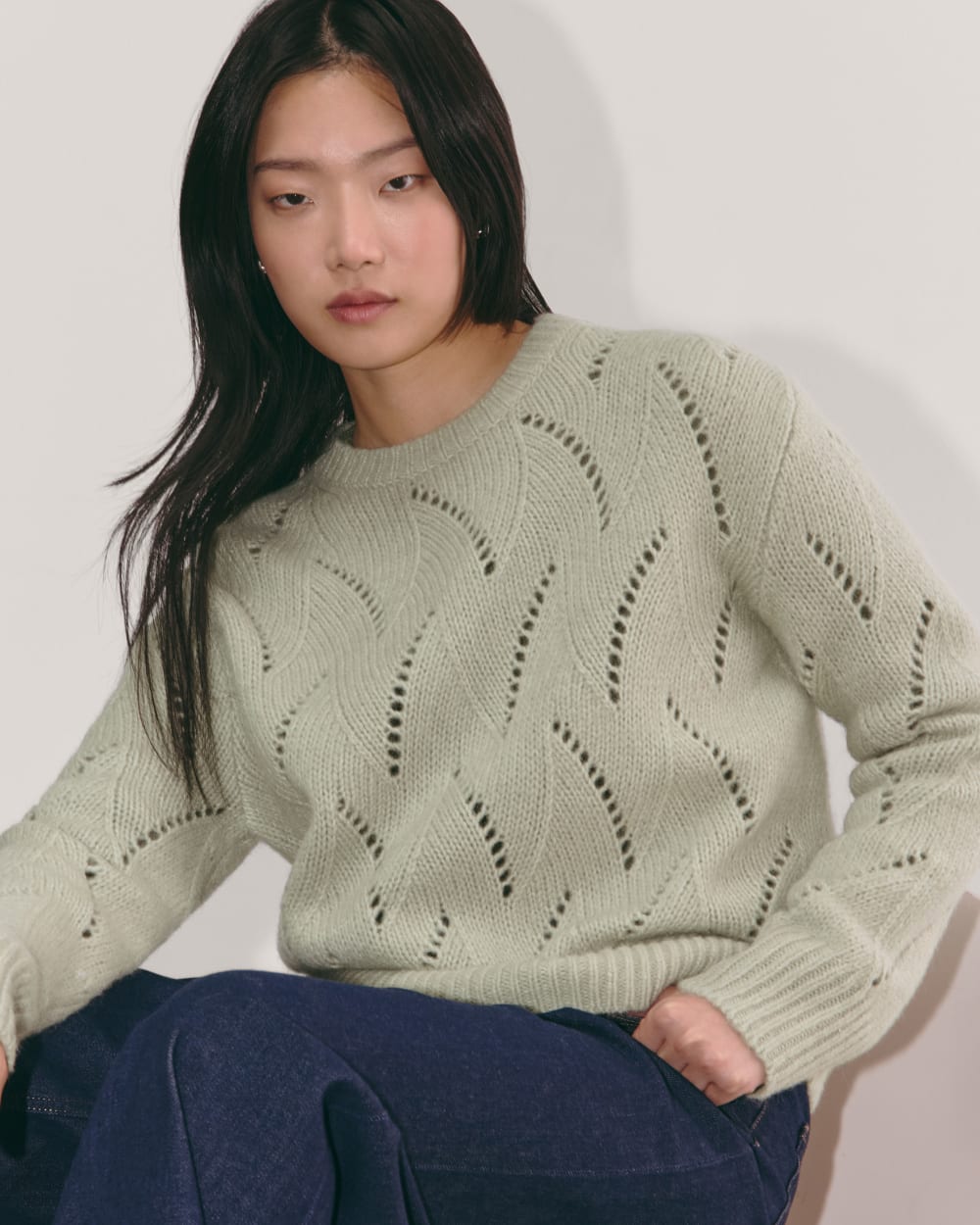 The Pointelle Sweater in Cloud in Seagrass — detail view