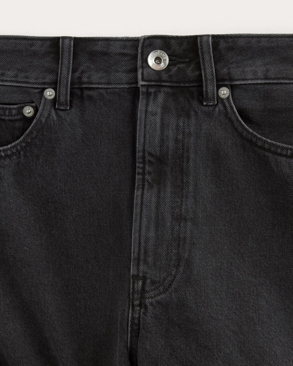 The A-Line Denim Short in Washed Black — detail view
