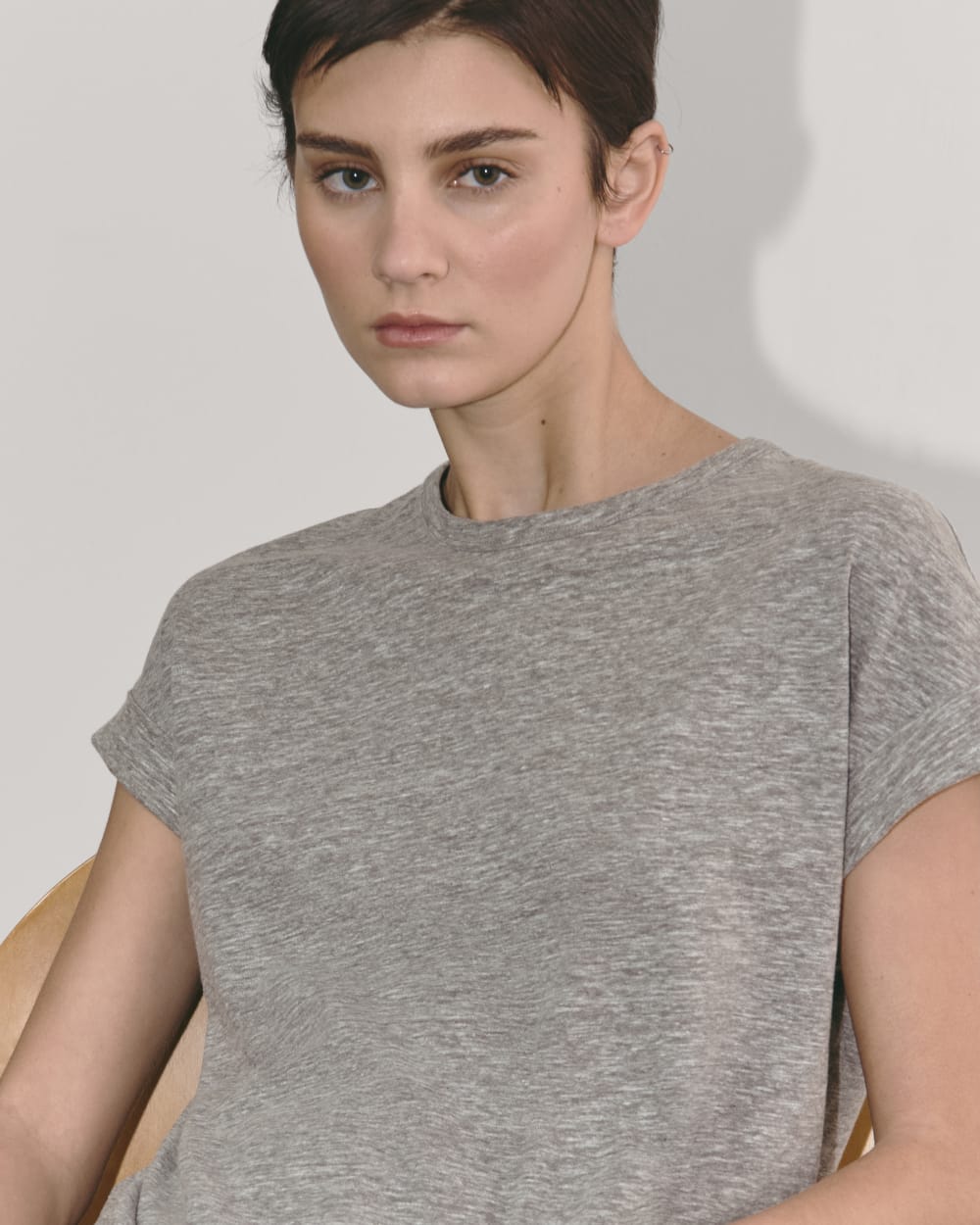 The Perform Tee in Heathered Grey — detail view