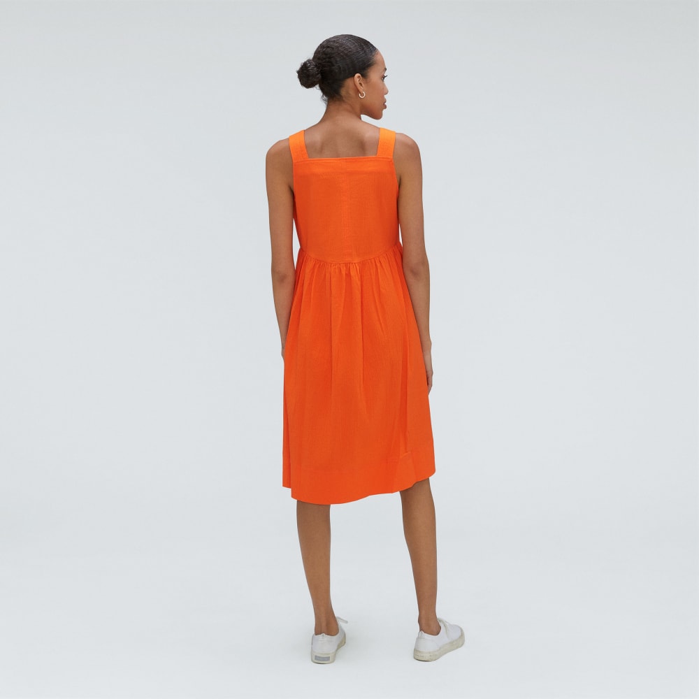 The Seersucker Midi Dress in Bright Orange — detail view