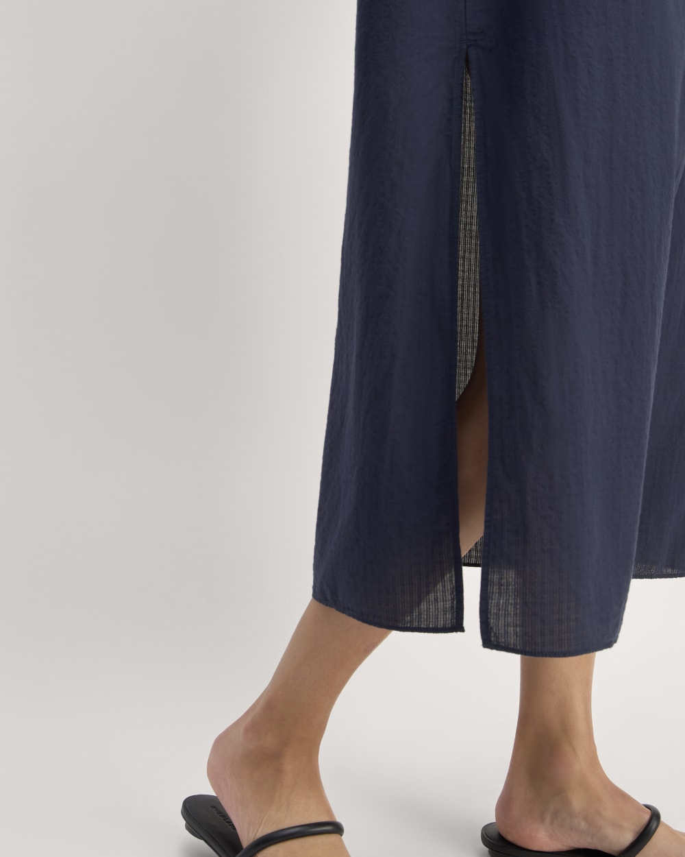 The Gauze Caftan Dress in Navy — detail view