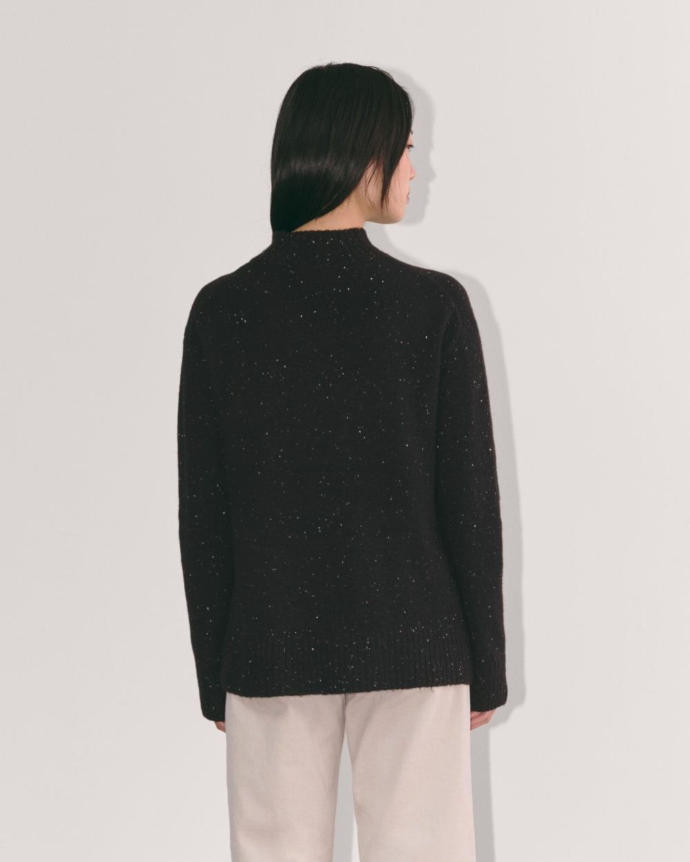The Mockneck Sweater in Plush Cotton in Black Confetti — detail view