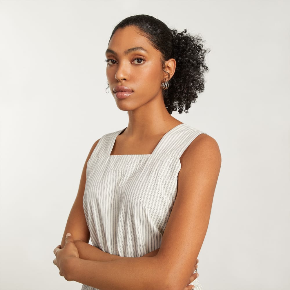 The Fatigue Apron Jumpsuit in Navy Stripe — detail view